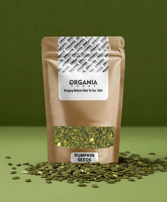 Bag of pumpkin seeds with 'Organia' label on a green background