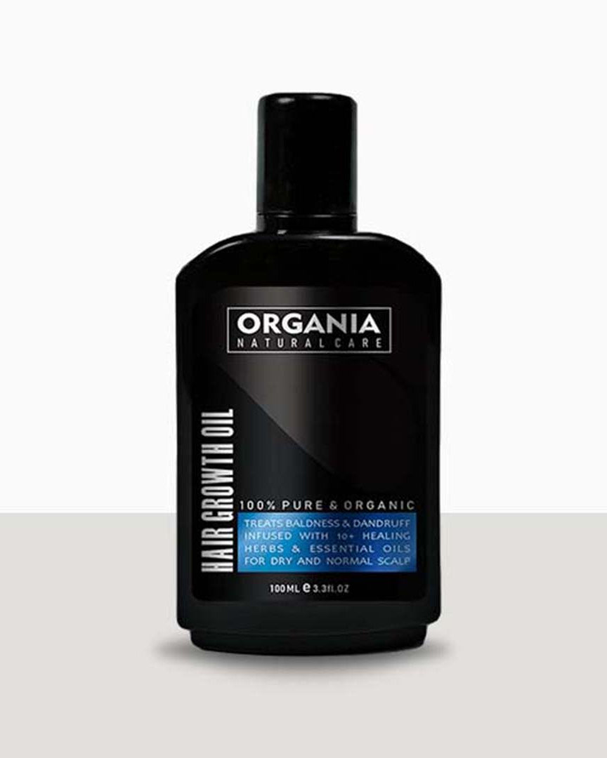Black bottle of Organia hair growth oil on a white background