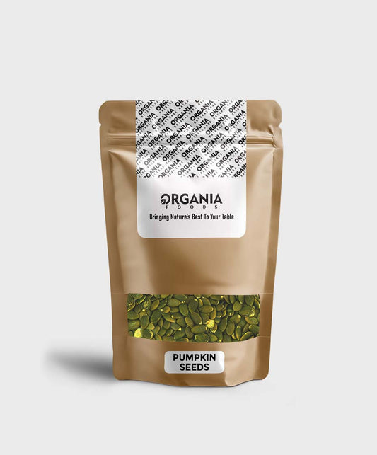 Bag of pumpkin seeds with 'Organia' label on a green background