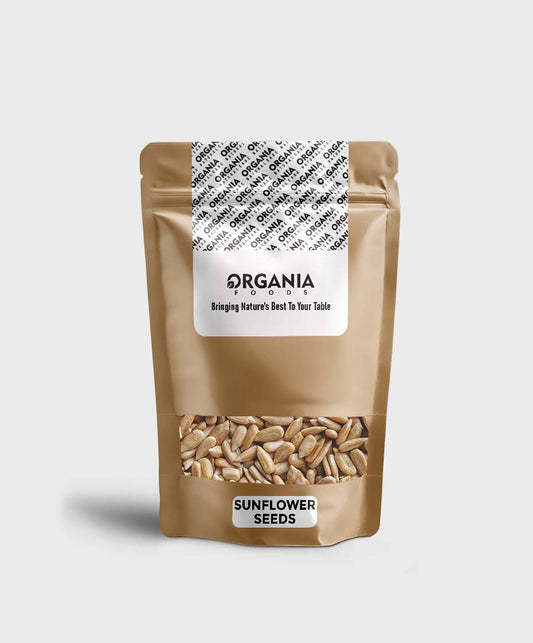 Bag of sunflower seeds with 'ORGANIA' label on a light gray background